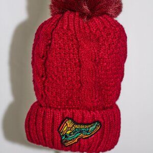 Red stocking cap with "Hiking Boot" patch and fuzzy lining